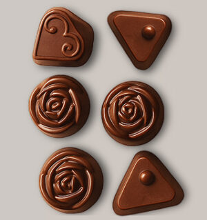 Assorted molded milk chocolates (rose and triangle shapes)