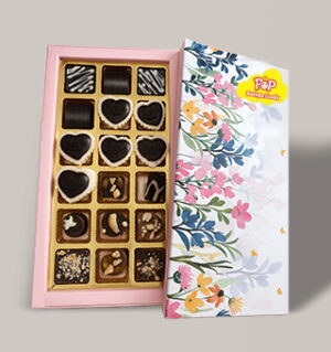 Assorted luxury heart and square dark chocolates in floral gift box
